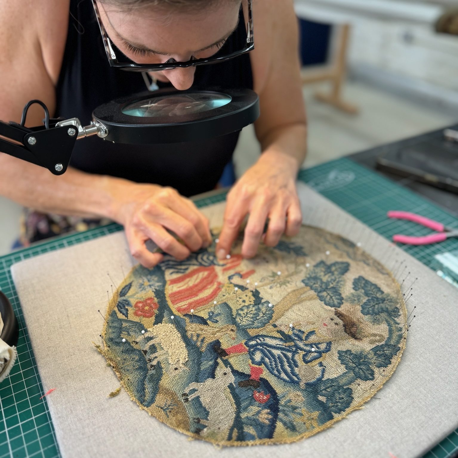 Stitching an 18th century needlepoint onto a custom-made padded board